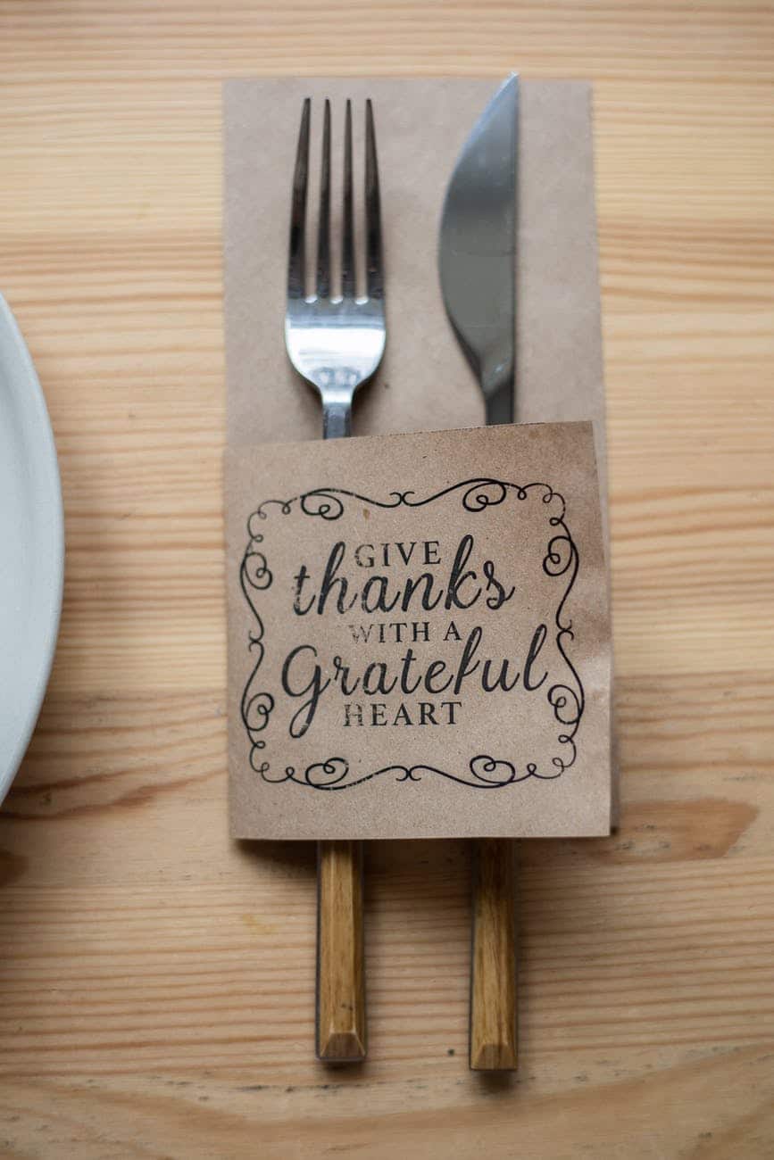 fork and knife in paper cover with inscription